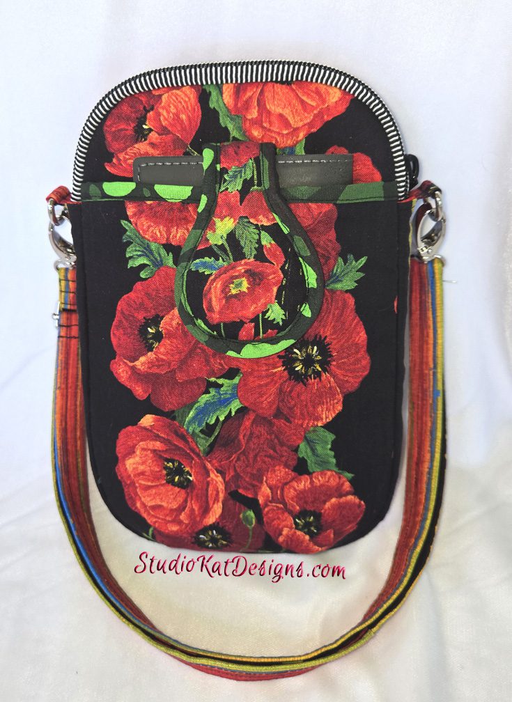 A red poppy bag with a black background