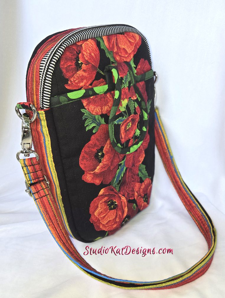 A red floral purse with a black background