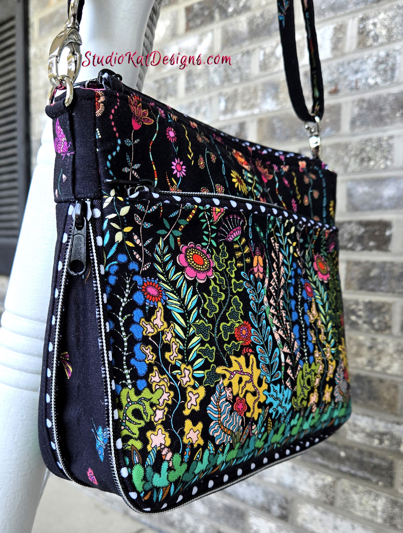 Colorful embroidered handbag with floral patterns.