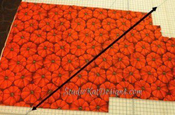 A red fabric Studio Kat Designs