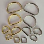 A group of different metal rings sitting on top of a table.