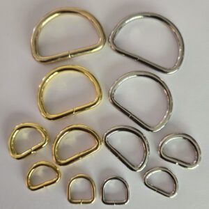 A group of different metal rings sitting on top of a table.