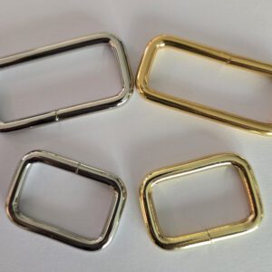A group of four metal rings sitting on top of a table.