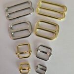 A group of different types of metal buckles.