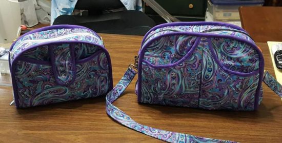 Two bags by Studio Kat Designs on the table