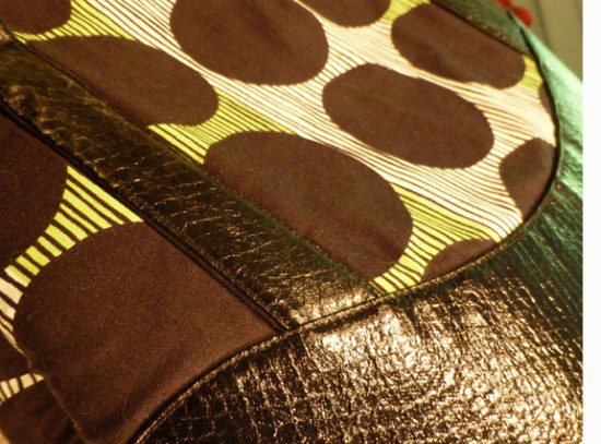 A closer look to a bag with black leather and circle designs