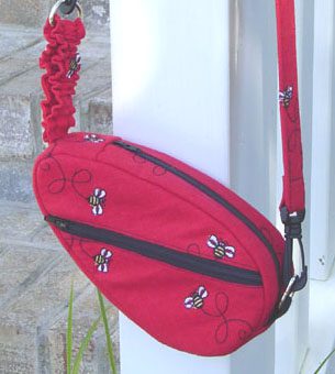 closeup of a Studio Kat Designs Red Sling Bag