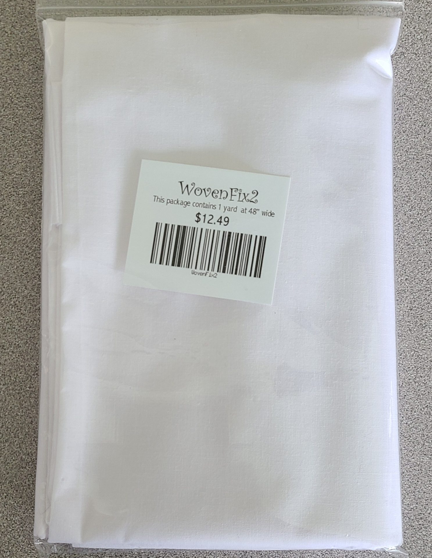A white piece of fabric with a barcode on it.