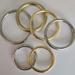 A group of metal rings sitting on top of each other.