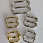 A group of different types of metal buckles.