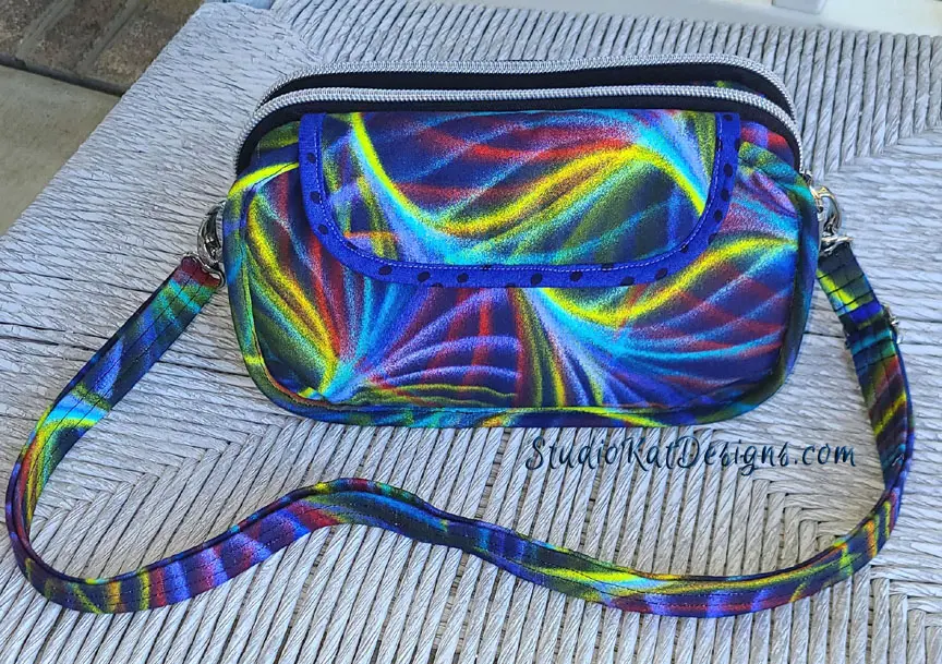 A colorful bag with a strap on it.