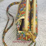A colorful purse with a zipper on it.