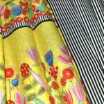 A close up of the Double Take, a yellow and black striped fabric.