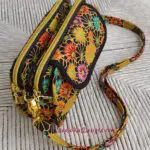 A purse with a floral pattern on it.