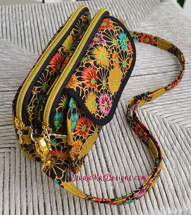 A purse with a floral pattern on it.