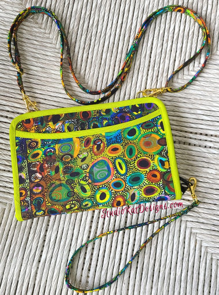 A colorful purse with a colorful pattern on it.