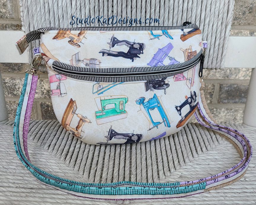 A purse with sewing machines on it.