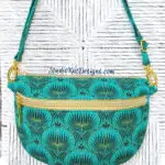 A teal and gold fanny pack on a white background.
