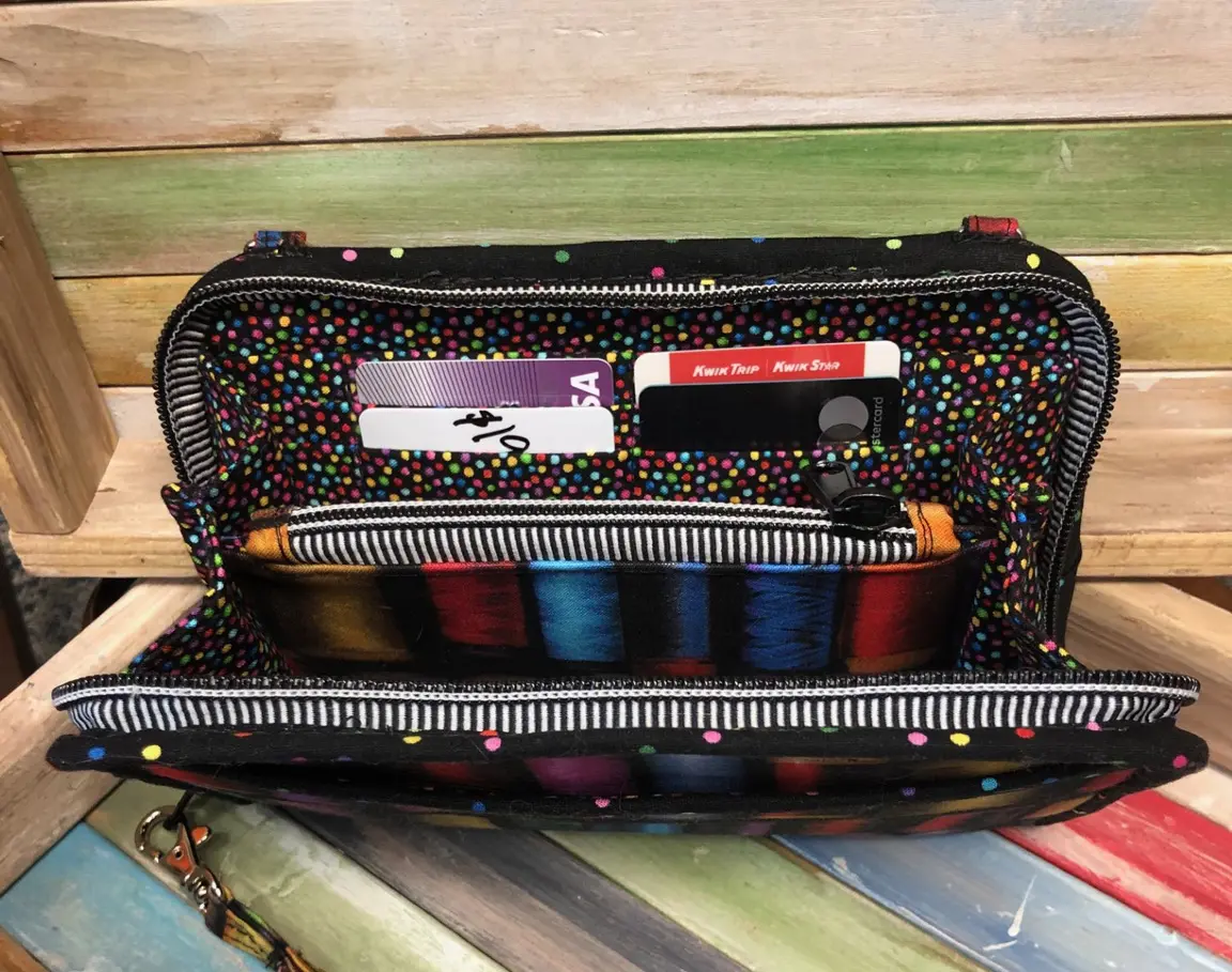A purse with a colorful pattern on it.