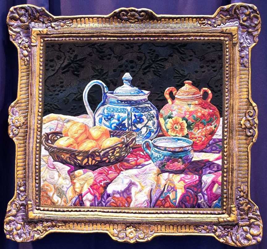 A painting of a tea pot and other things in a frame.