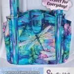 A bag with a picture of a blue and green dragonfly.