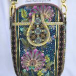 A purse with a colorful floral design on it.
