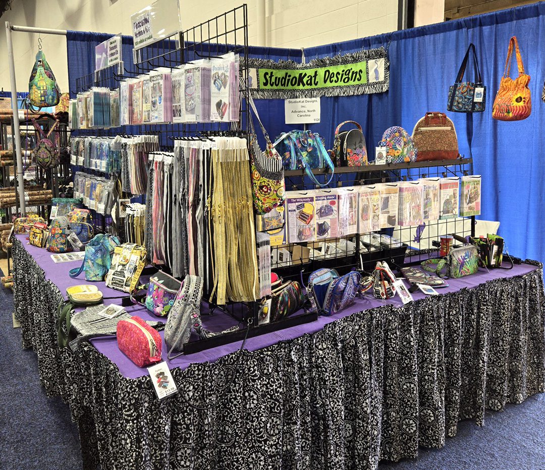 A table with several different types of fabric on it.