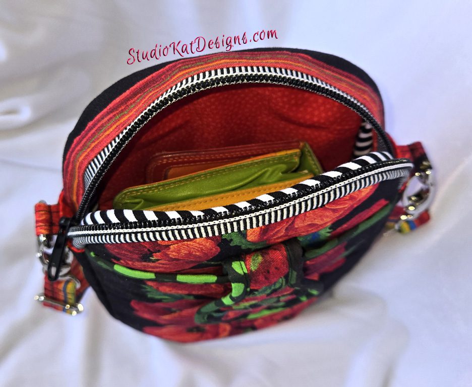 A purse that has been opened to show the inside of it.