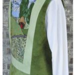 Green and light green vest worn over a white shirt. Green and light green vest worn over a white shirt.