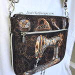 Brown steampunk-themed bag with sewing machine and gears design.