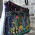 Colorful embroidered handbag with floral patterns.