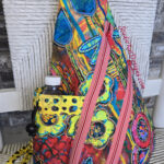 Colorful patterned sling bag with water bottle