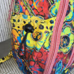 Colorful floral patterned drawstring backpack close-up