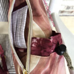 Open pink patterned fabric handbag showing interior