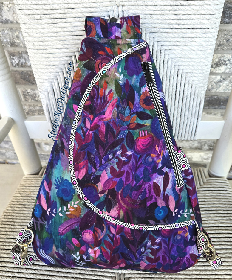 Purple floral drawstring backpack with zipper