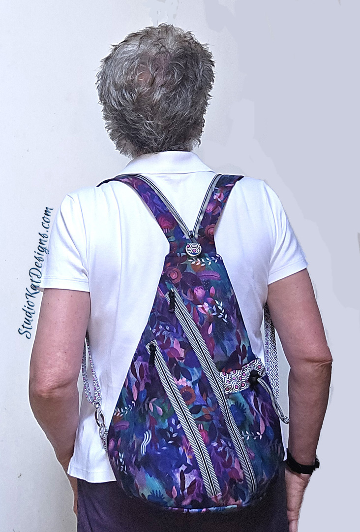 Back view of person with purple patterned backpack