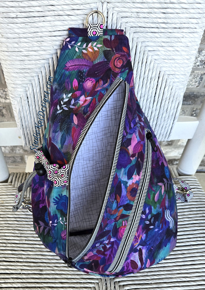 Colorful floral sling bag with diagonal zippers